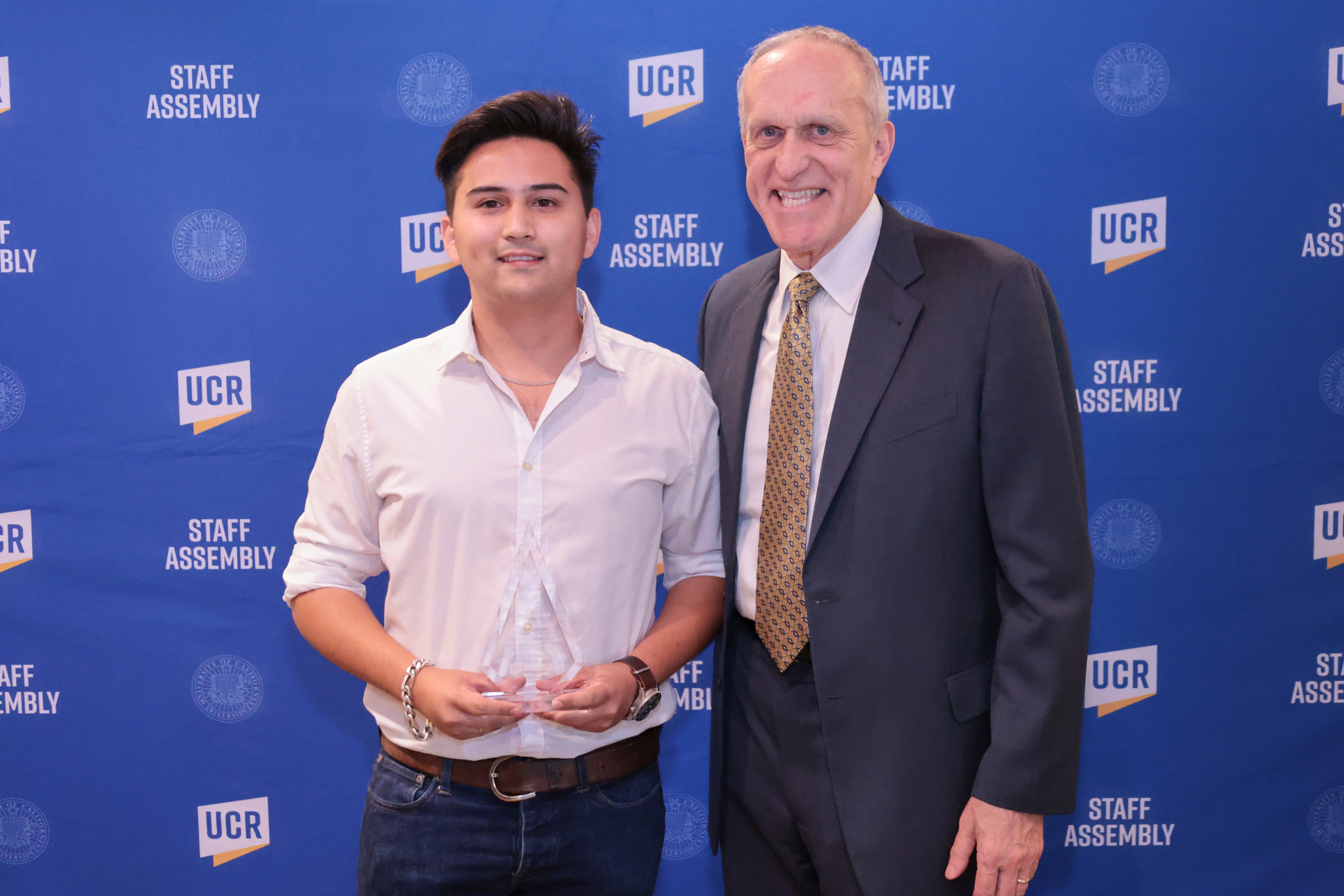 Volunteer of the Year winner Dante Kruise with Chancellor Wilcox at the 2022 Outstanding Staff Awards