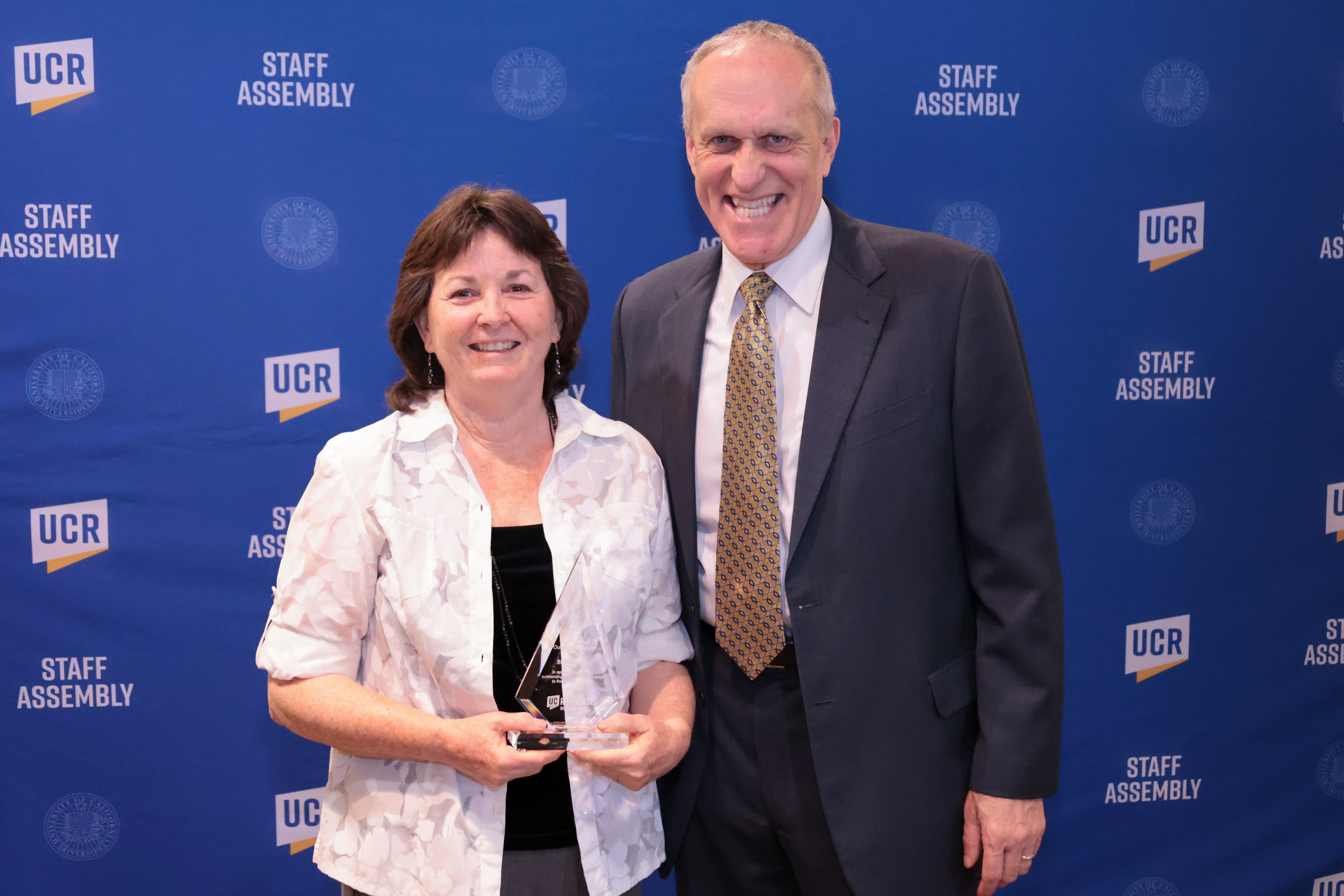 Sheryl Hayes, the Mary Johnson Outstanding Retiree award winner, with Chancellor Wilcox at the 2022 Outstanding Staff Awards