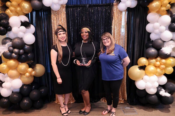 Three staff at the 2022 Outstanding Staff Awards