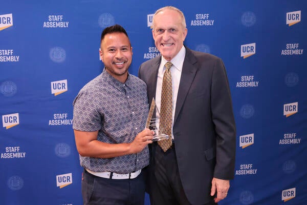 Diversity award winner Melbert Sebayan with Chancellor Wilcox at the 2022 Outstanding Staff Awards