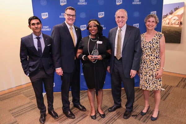 Staff Who Make a Difference award winner Cortney Crooms with Agam Patel, Staff Assembly President, Jeff Girod, Staff Assembly Past President, Chancellor Wilcox and Provost Watkins at the 2022 Outstanding Staff Awards