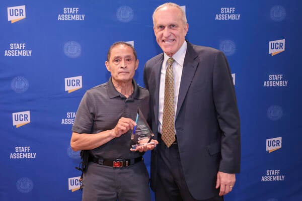 Staff Who Make a Difference award winner Francisco Hernandez with Chancellor Wilcox at the 2022 Outstanding Staff Awards