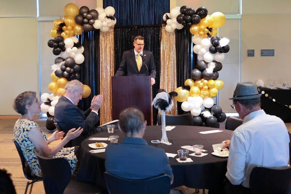 Staff Assembly '21-'22 President Jeff Girod welcoming the 2022 Outstanding Staff Awards winners