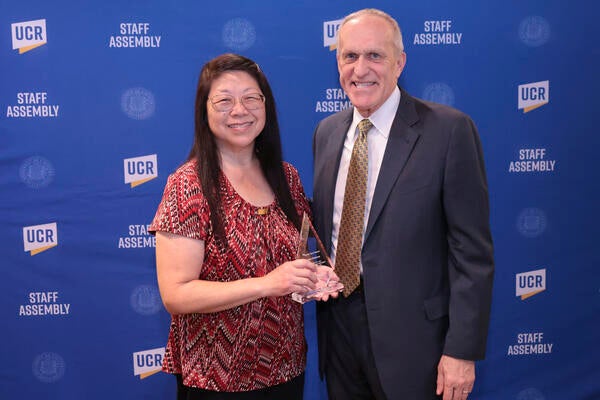 Tartan Soul winner Susan Komura with Chancellor Wilcox at the 2022 Outstanding Staff Awards