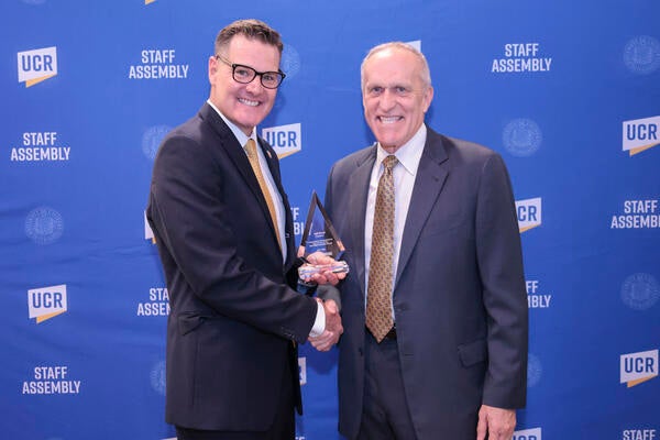 Staff Assembly 2021-2022 President Jeff Girod with Chancellor Wilcox at the 2022 Outstanding Staff Awards