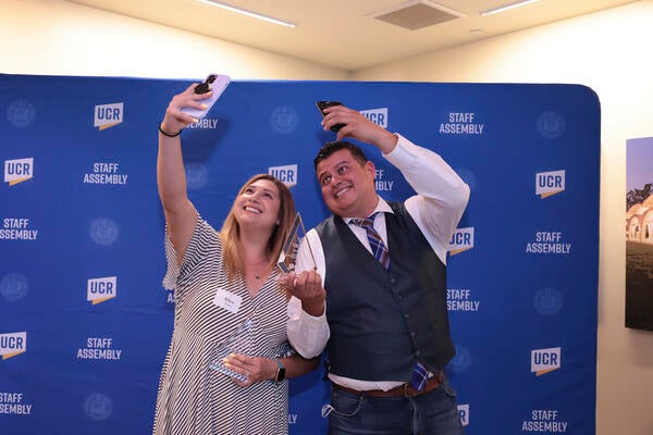 two staff taking a selfie at the Outstanding Staff Awards