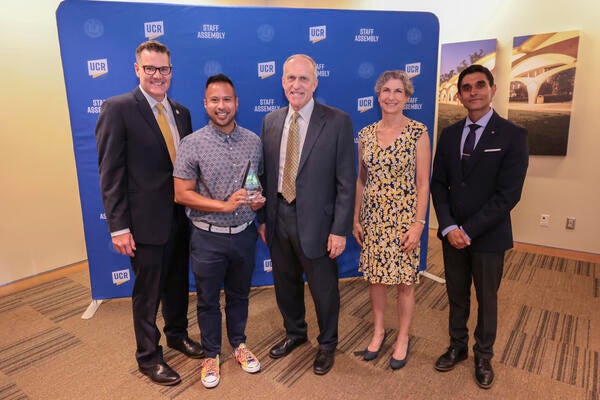 Diversity award winner Melbert Sebayan with Staff Assembly 2021-2022 President Jeff Girod, Chancellor Wilcox, Provost Watkins, and Staff Assembly 2022-2023 President Agam Patel at the 2022 Outstanding Staff Awards