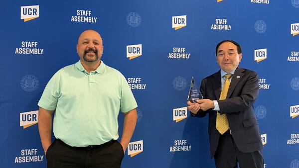 CHRO Alex Najera and Chancellor S. Jack Hu at the 2026 Outstanding Staff Awards.