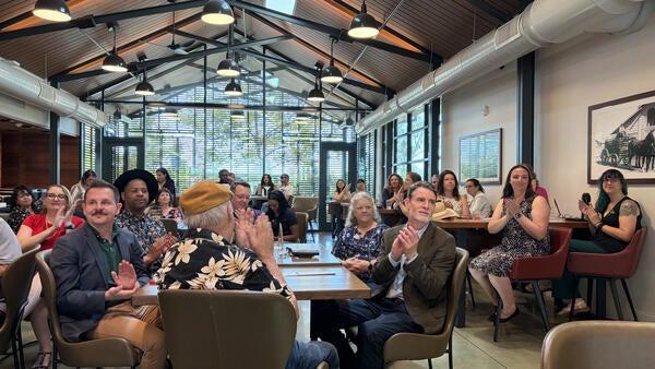2026 Outstanding Staff Awards attendees clapping.