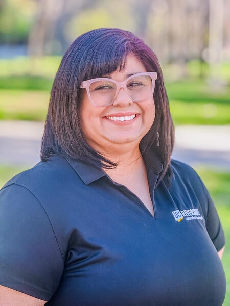Stella Rocha, Student Academic Specialist at UC Riverside, wearing a black UCR branded polo, smiling 