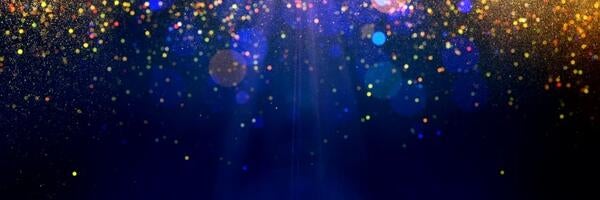 gold sparkles on a blue background